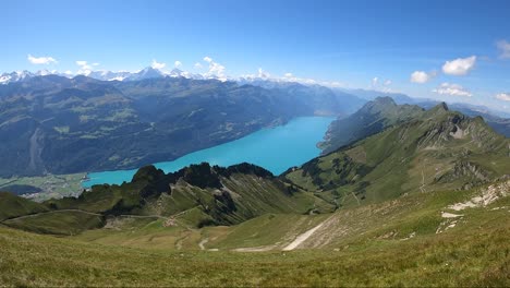 tourist hike at brienz lake grasslands, mountains, valleys and meadows in switzerland