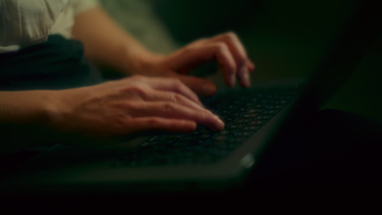 Smiling Woman Browsing Internet On Laptop Late At Night