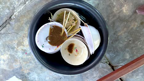 stacked bowls with noodles and sauce