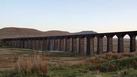 parallax shot sliding to the right at sunset of ribblehead viaduct