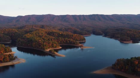 aerial: lake with colorful fall foliage