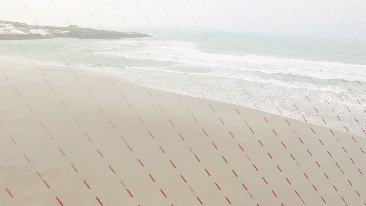 Drone descending and panning, revealing sandy beach, breaking waves and fading dashed overlay