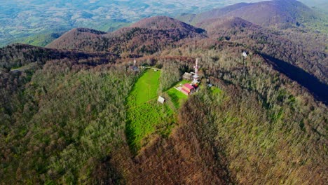 Aerial-4K-drone-footage-of-a-TV-and-radio-communication-center-on-the-top-of-the-mountain-in-the-spring-time