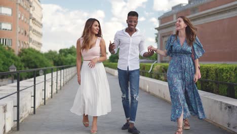 friends walking and talking outdoors