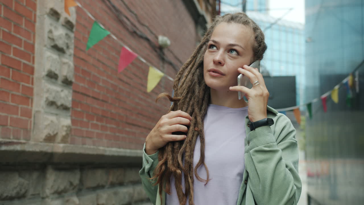 Woman Talking on Phone in the City