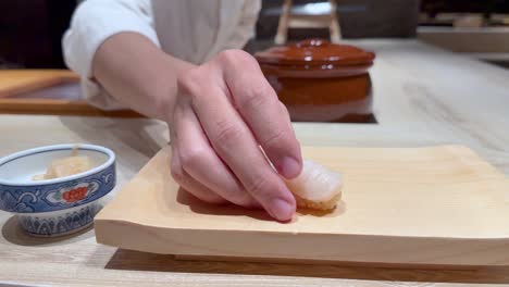 chef skillfully prepares and presents sushi nigiri