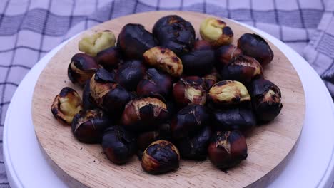 roasted chestnuts rotating on a turntable