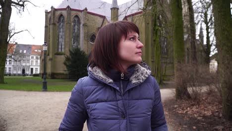 girl walking at the european city. bruges belgium