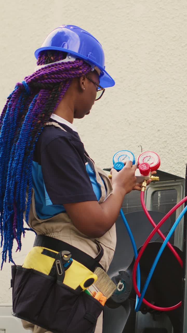 Vertical video Engineer calibrating manifold gauges