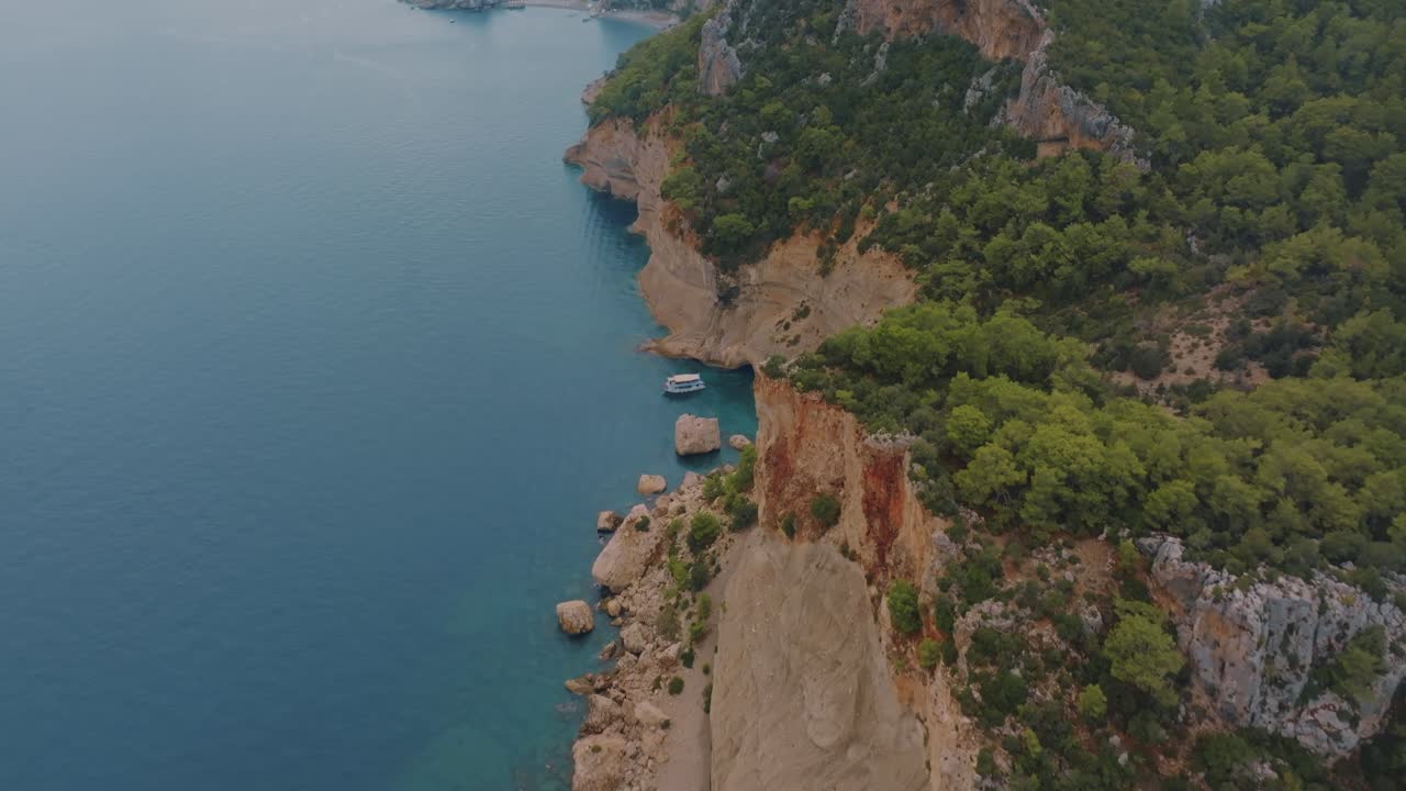 Coastal Landscape with Boat and Cliffside Scenery