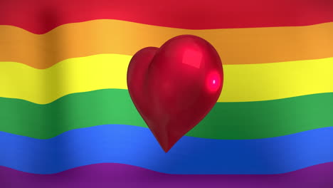 animación del corazón girando sobre la bandera del arco iris