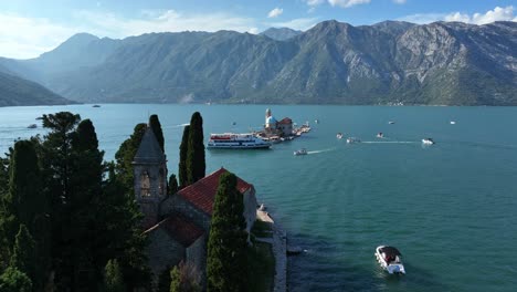 boats around the our lady of the rocks from saint george monastery in perast, montenegro. - aerial shot