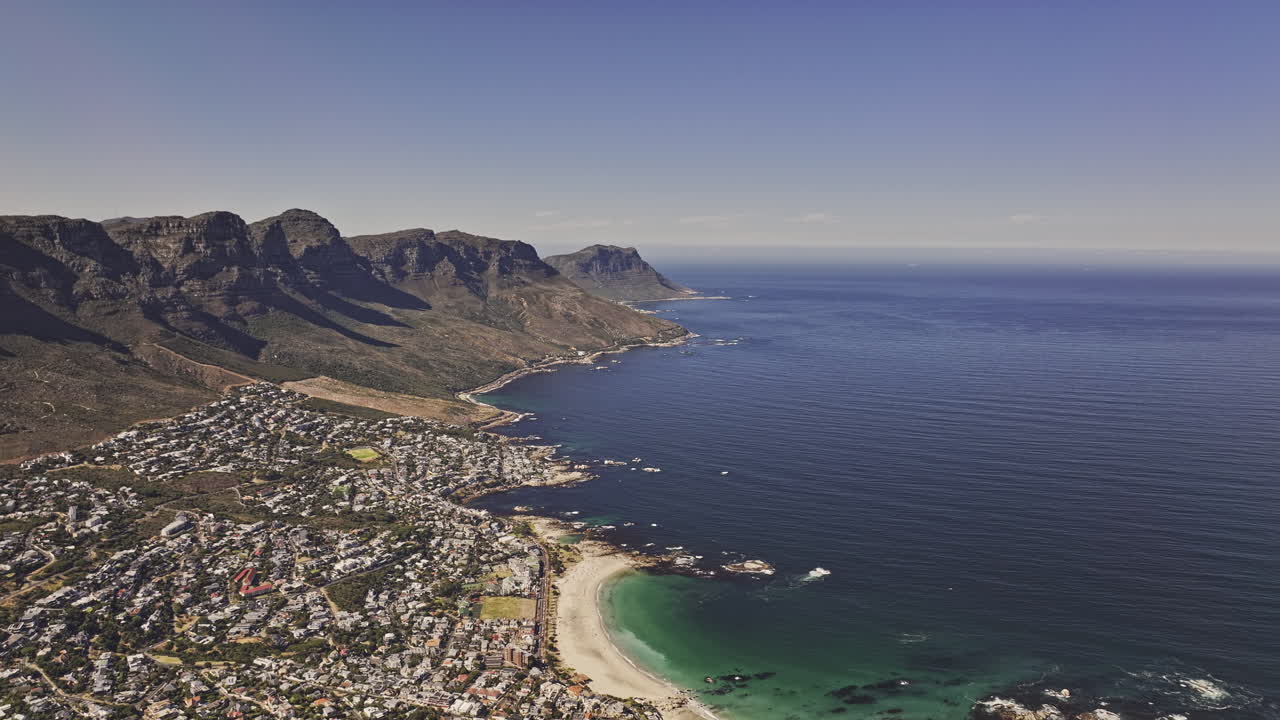 Cape Town South Africa Aerial v22 high altitude flyover Clifton capturing Camps Bay and Bakoven residential suburbs, sandy beach and Table Mountain views - Shot with Mavic 3 Pro Cine - Jan 11th 2024