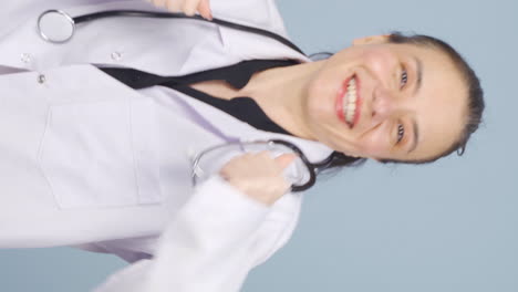 vertical video of dancing doctor. happy and cute.