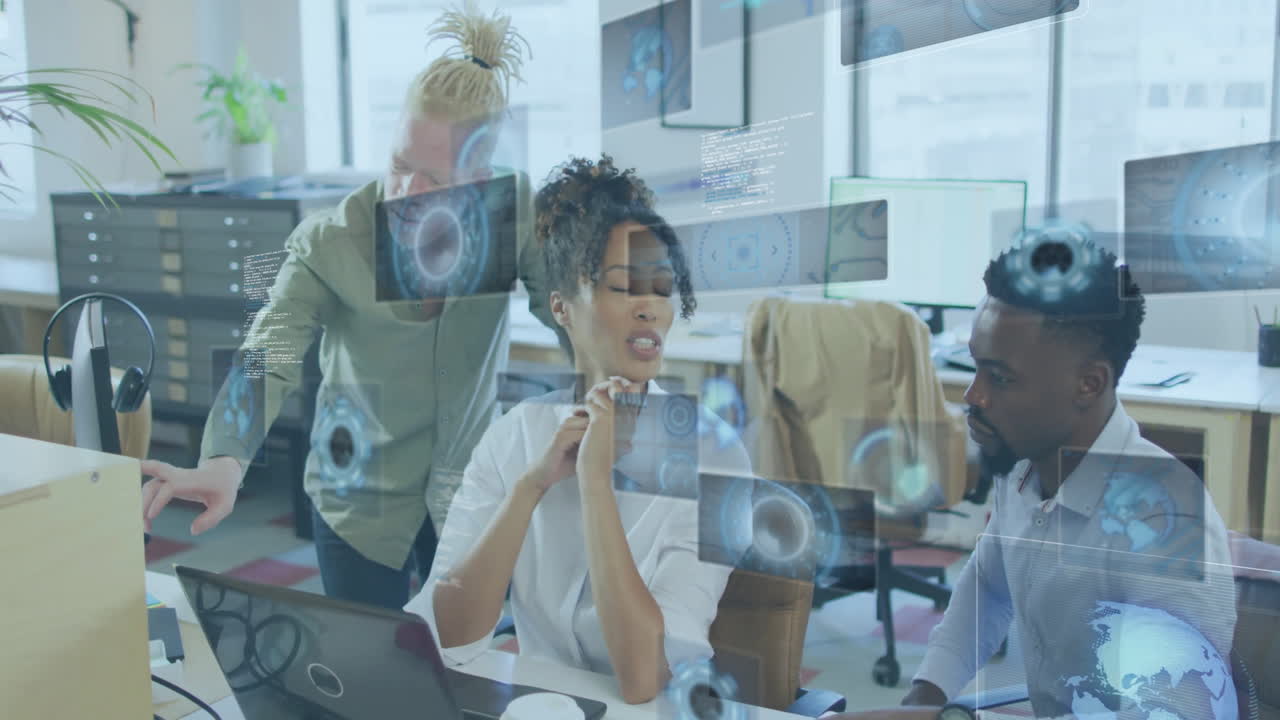 Diverse team collaborating at office with digital data processing animation overlay