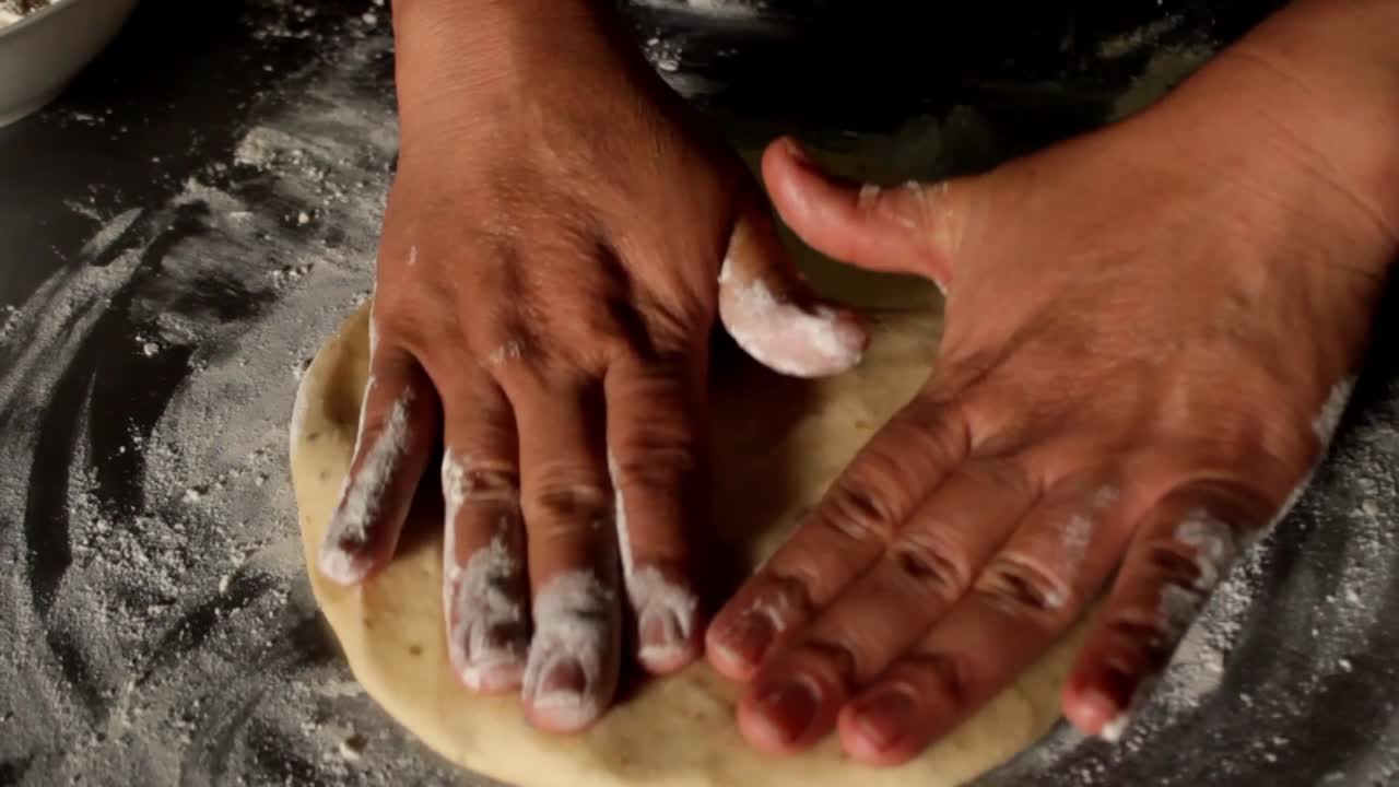 top view of a female hands making pizza, pizza dough