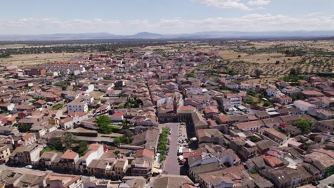Oropesa-Spanish-small-town-traditional-neighbourhood-building-aerial-view-orbiting-scenic-bright-countryside