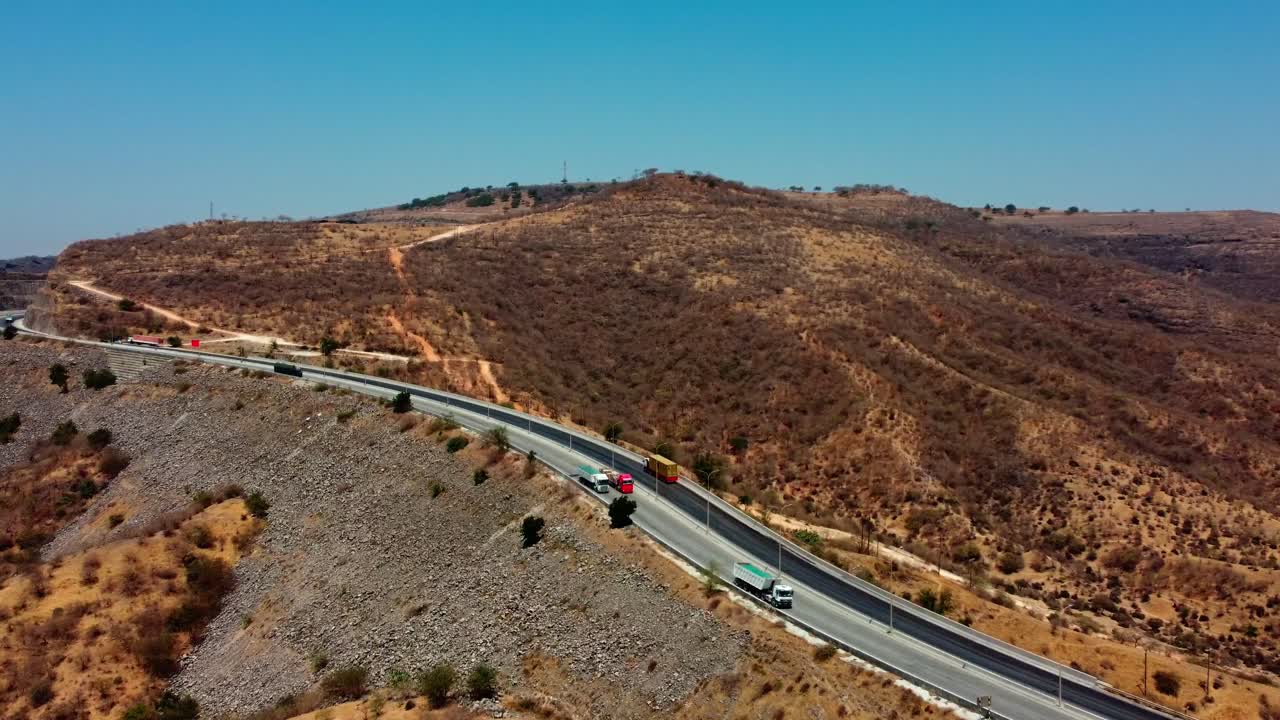 Cargo trucks showcase Oman's economic development. A glimpse into the country's growth. Watch now!