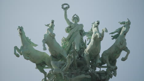 close up of sculpture on the great palace in paris meaning immortality ahead of time