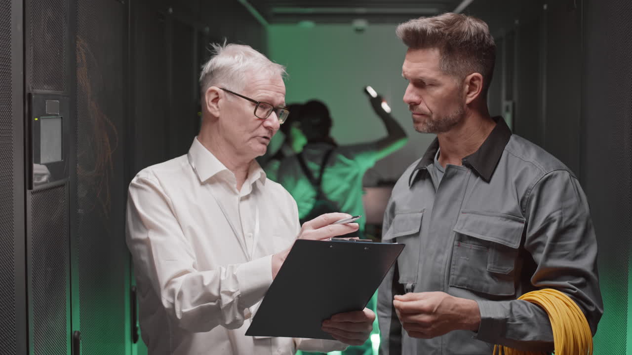 Technicians Inspecting Data Center Server Room
