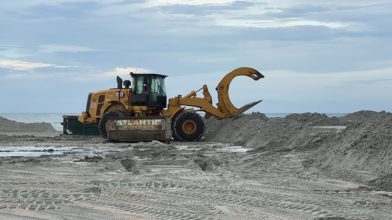 Construction equipment working on beach sand replenishment job site