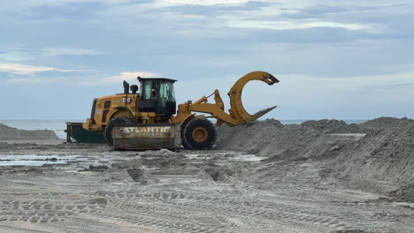 construction equipment working on beach sand replenishment job site