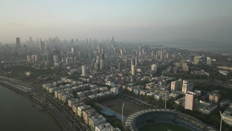 aerial view of mumbai cityscape, dense skyline full of skyscrapers, ascending shot