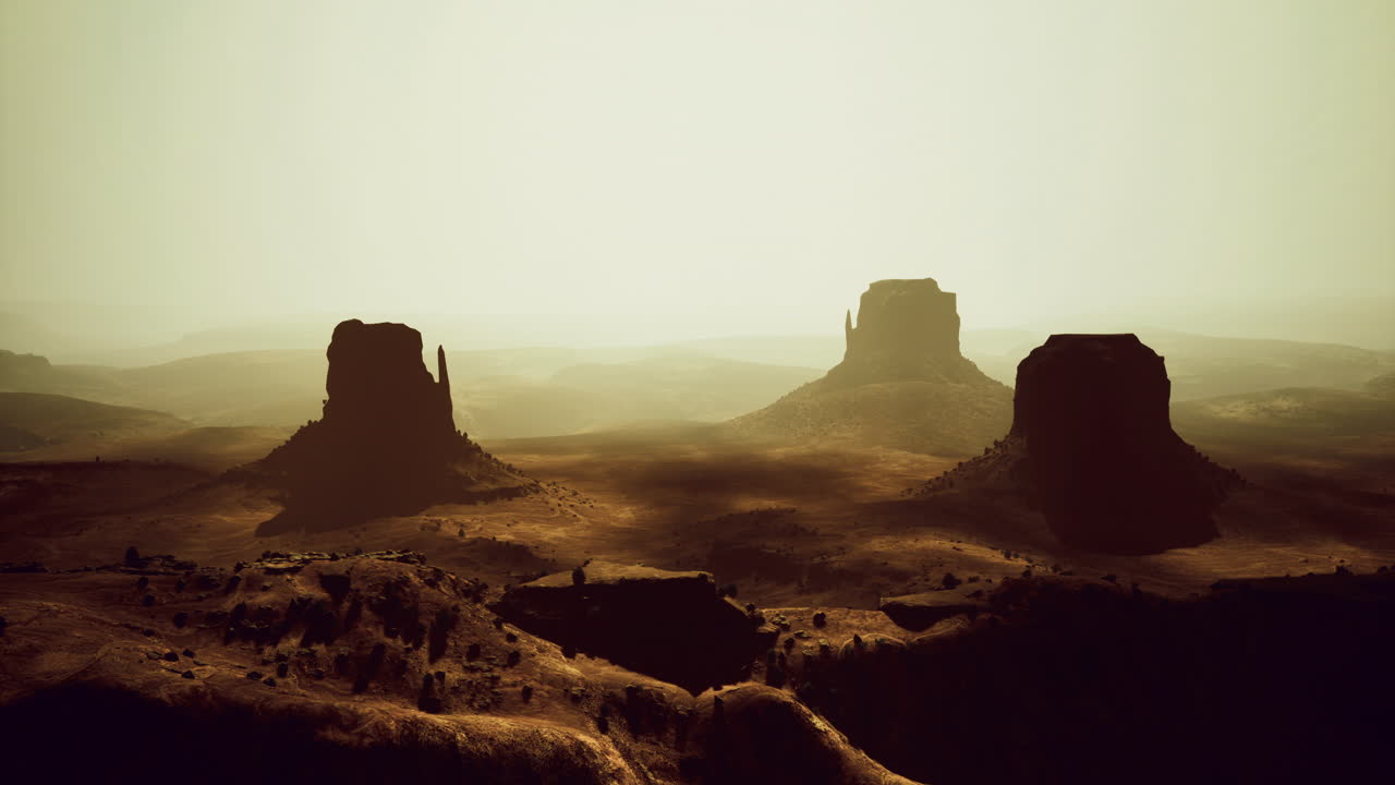 Majestic rock formations in a desert landscape during golden hour