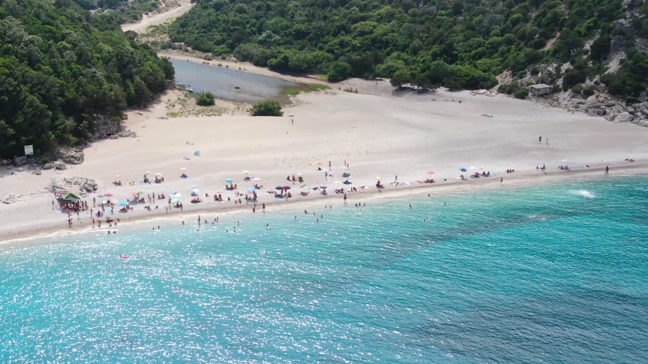 Aerial view of a beach. Pan right