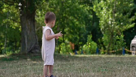 baby boy playing in a park