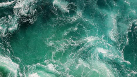 blue waves of water of the river and the sea meet each other during high tide and low tide.