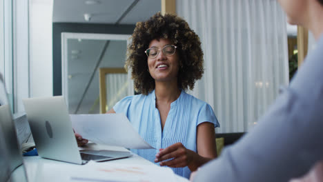 Diverse-business-colleagues-in-discussion-at-a-casual-meeting-in-the-office