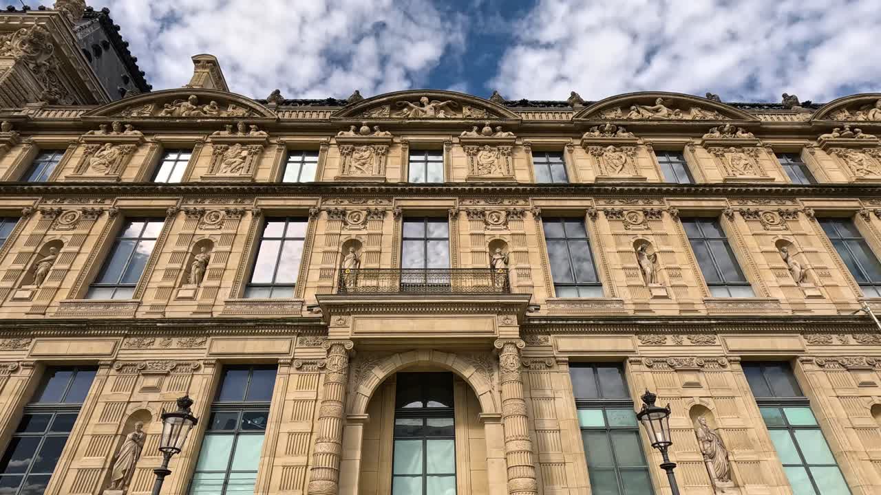 Detailed view of Louvre Museum's ornate facade
