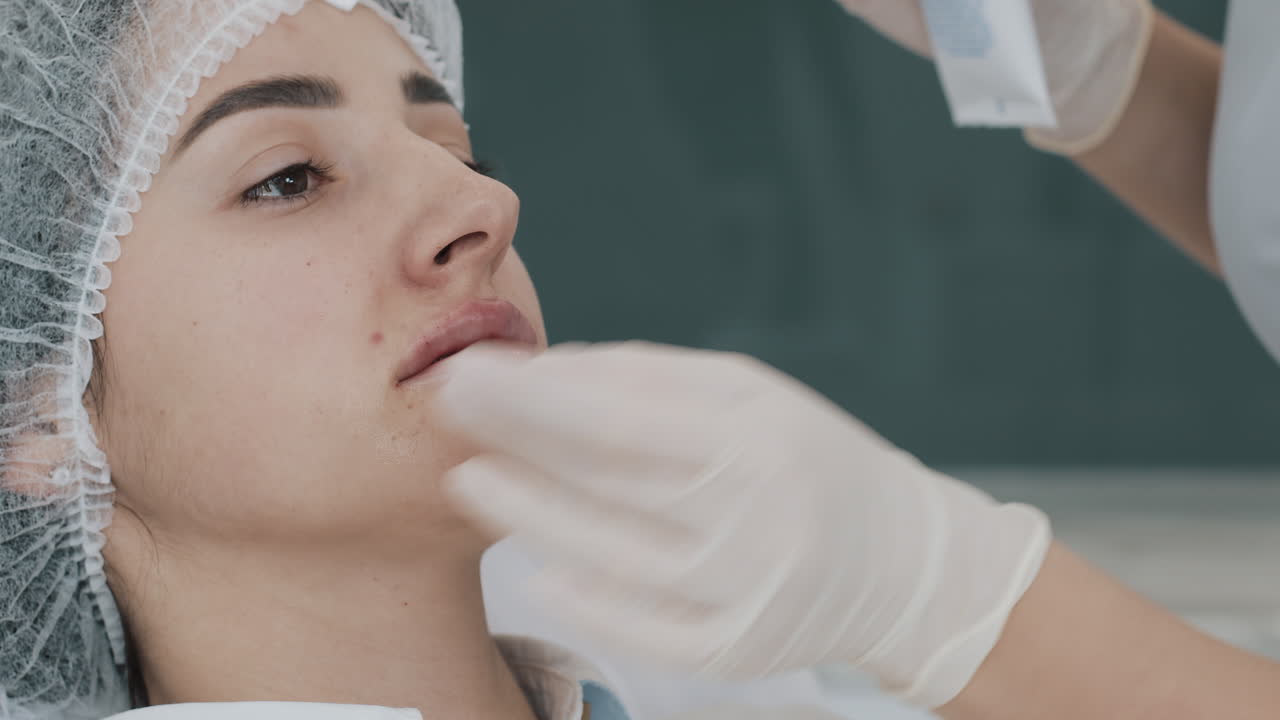 Woman undergoing a cosmetic lip treatment