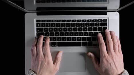 a man working on a laptop online from his home