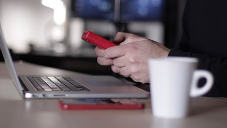 Caucasian-man's-hands-plays-video-game-instead-working-on-laptop