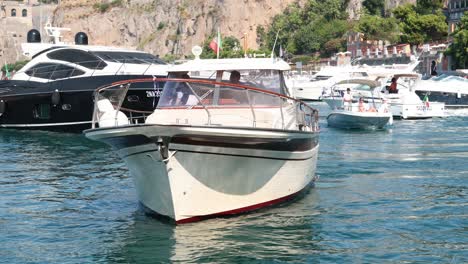 multiple boats maneuvering in sorrento, naples, italy