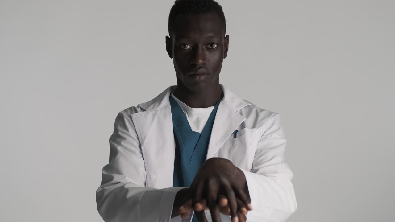 African american doctor on grey background.