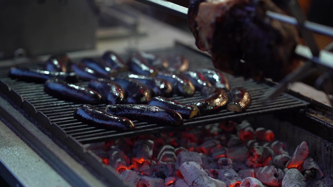 Fresh Eggplants and Meat Cooking on a Hot Barbecue Grill