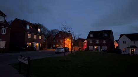 slow pan around shot of a housing estate in england just after the sun set and it started to get darker as the night got closer