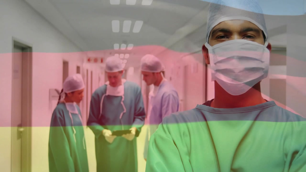 Kameraet panorerer over et medicinsk team, der konsulterer en patientjournal og forbereder en operation, med en flag-overlejring, der forener gruppen.