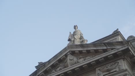 calm shot of the historical neo-classical facade of a building of the national bank of belgium, in brussels, on a warm sunny day