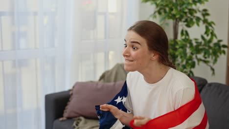 excited fan celebrating with american flag