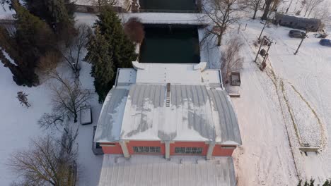 Drone-shot-of-small-hydro-power-plant-Haj-on-Czech-Morava-river-in-winter