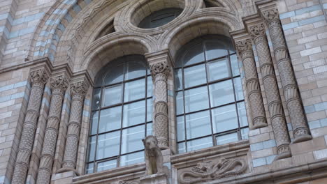 close up of exterior and window of natural history museum in london, england, uk