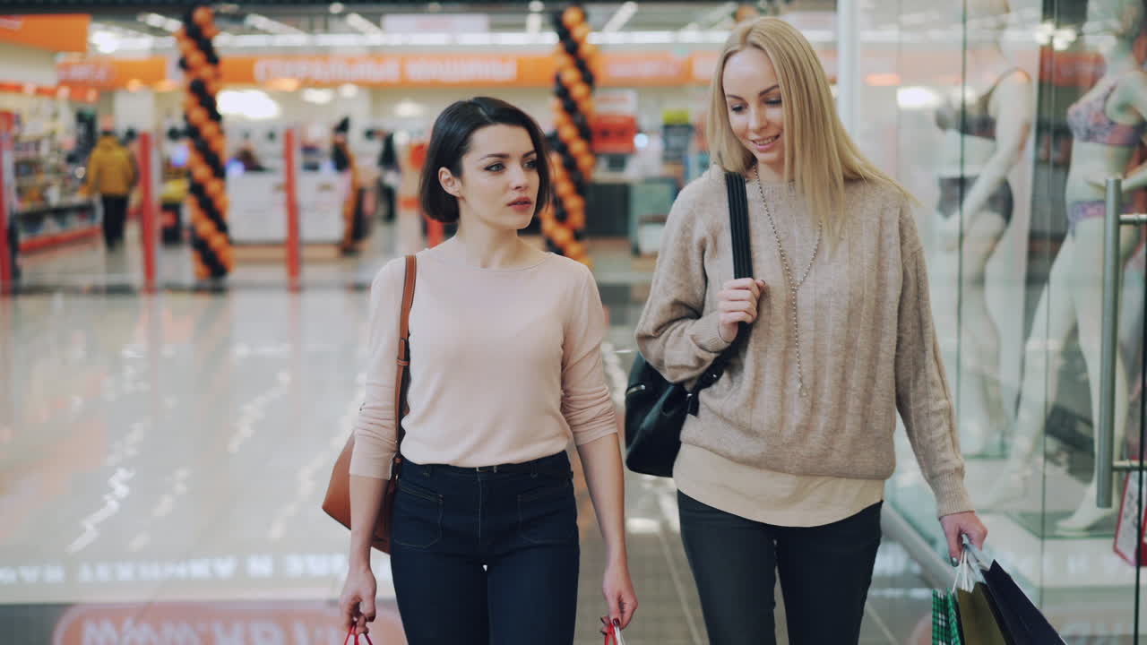 Two Women Shopping in a Mall