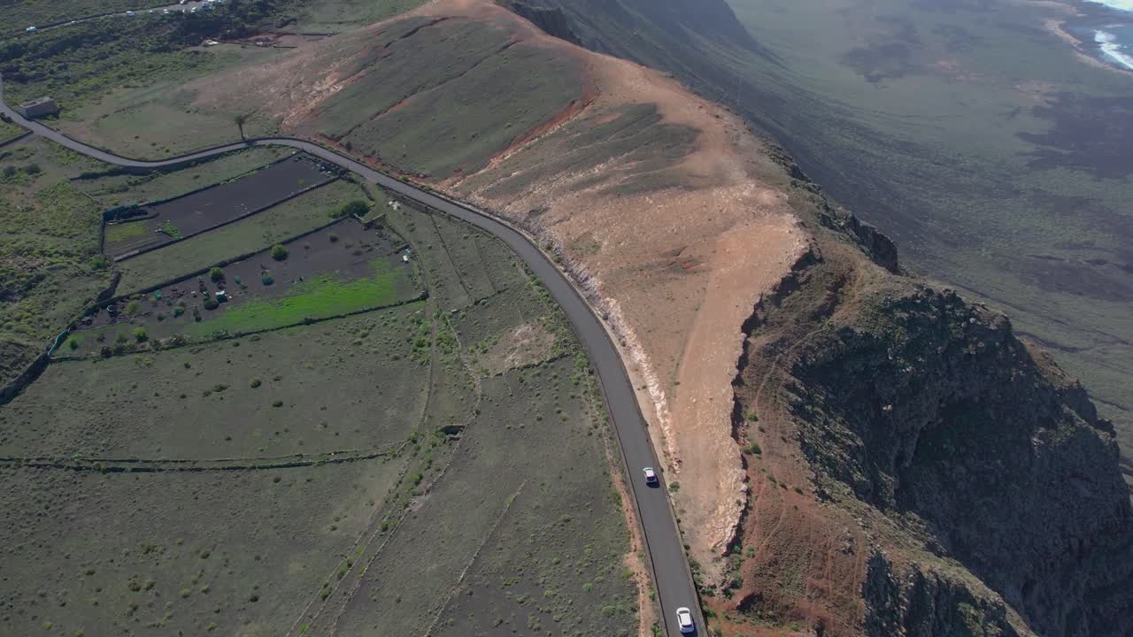 Aerial drone view of mountain sea and volcanoes in Lanzarote, Canary Islands, Spain