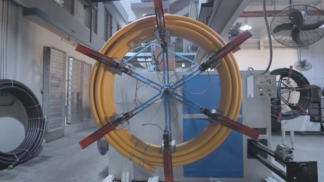 Closeup shot of big wheel used for rotating PVC pipes in a circular manner. PVC Pipe Making Factory in Karachi, Pakistan.