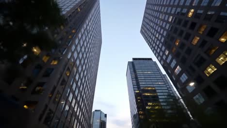 a majestic view of modern skyscrapers at dusk, showcasing the architectural grandeur and urban landscape of a vibrant city skyline