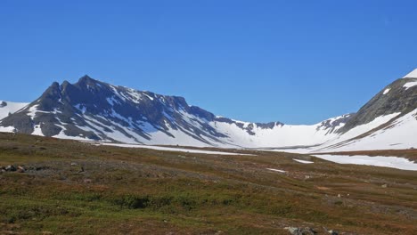 snow-covered mountains of sylarna under blue sky in sweden